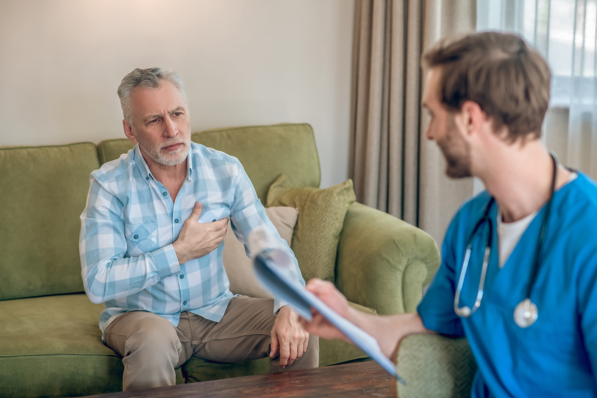 Male patient discussing his heart problem with a doctor